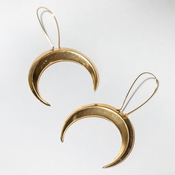 Gold Brass Crescent Moon Earrings for Women against a white background